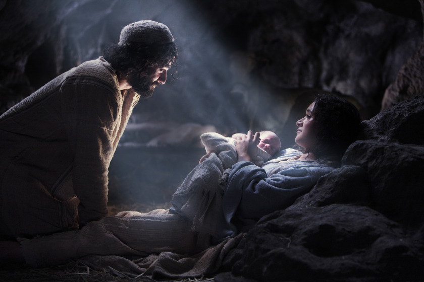 Joseph looking at Mary holding the Baby Jesus